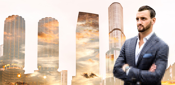 Businessman portrait against Chicago downtown buildings, USA.