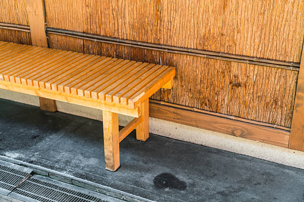 istock Wooden bench against a wooden wall 623690546