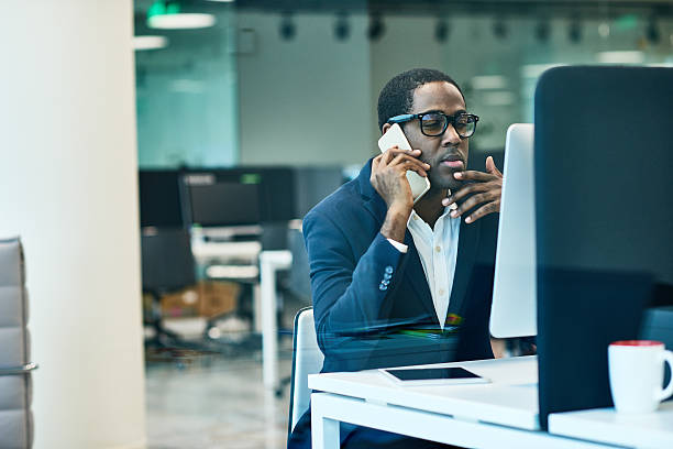istock Pensive businessman talking on phone 623692392