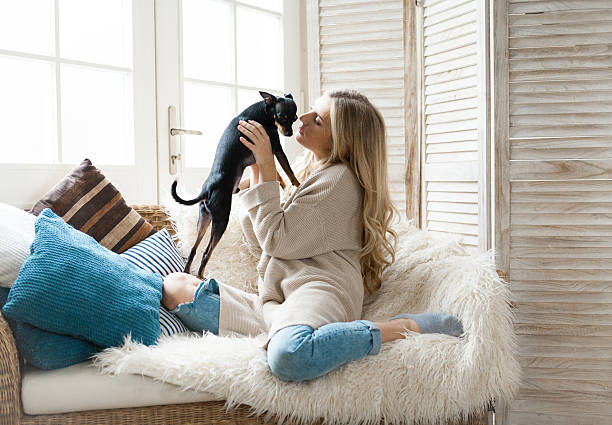 istock Woman cuddling her dog 623692768