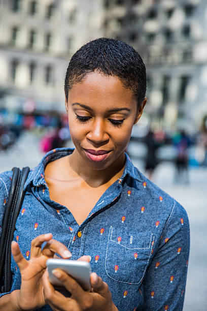 istock Woman texting in the streets in Chicago 623693526