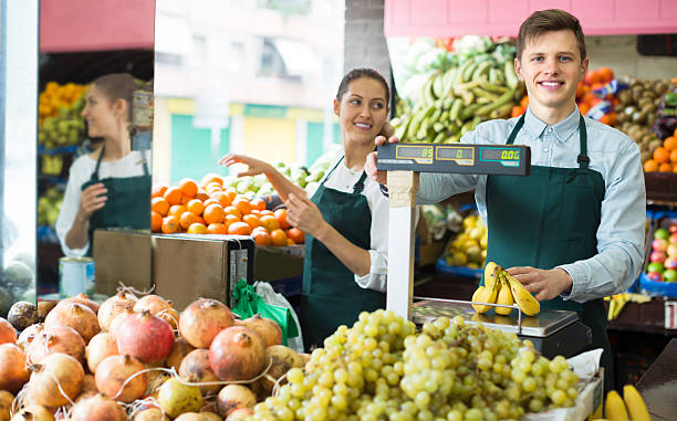 istock Sellers with bananas at market 623694612
