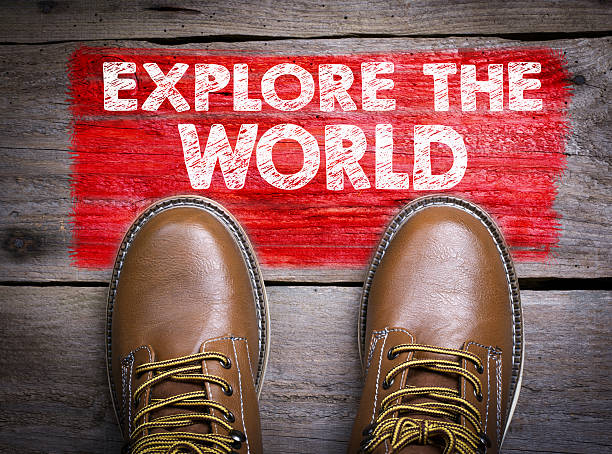 istock Explore the World. Top View of Boot on wooden background 623695888