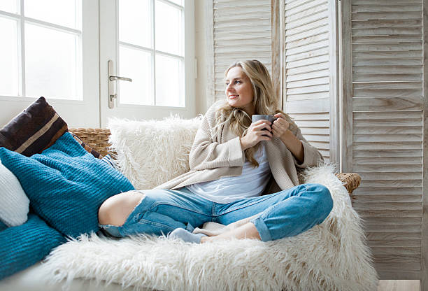 istock Woman drinking tea at home 623696610