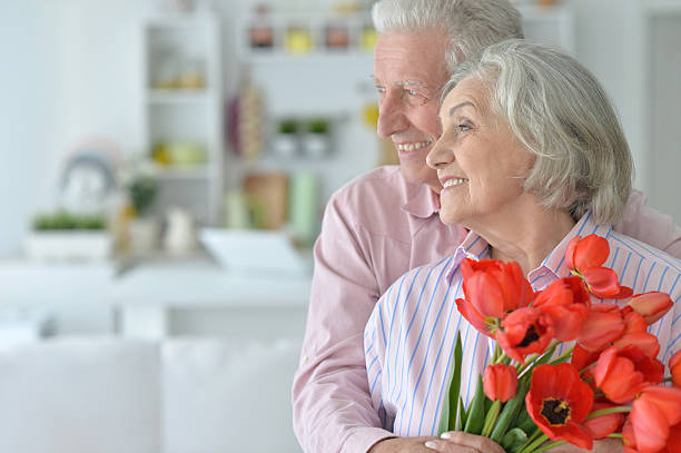istock Mature couple with poppies 623696772