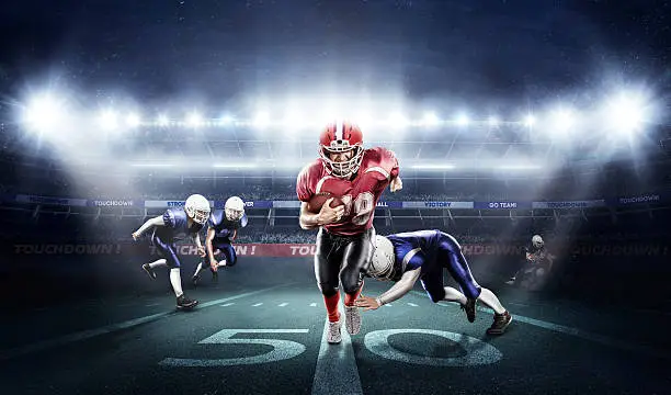 Photo of American football players in action on stadium with ball