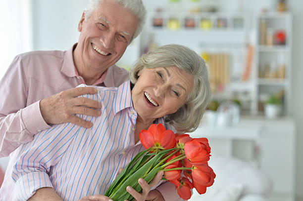 istock Mature couple with poppies 623697392