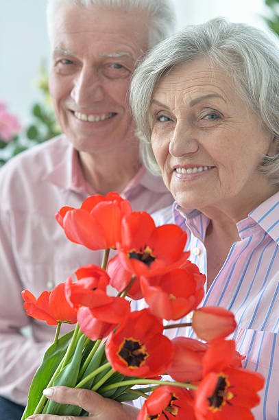 istock Mature couple with poppies 623697724