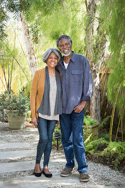 istock Senior African American couple standing on garden path, smiling 623699268
