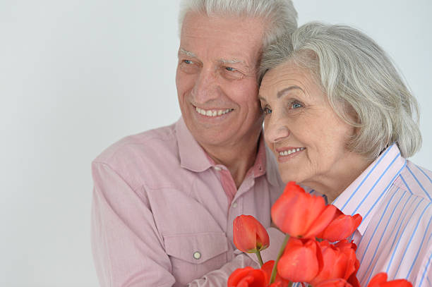 istock Mature couple with poppies 623700100