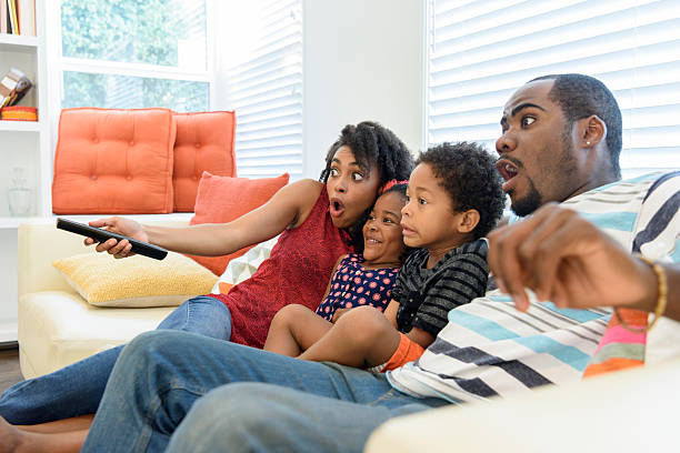 istock African American family watching television together 623700868