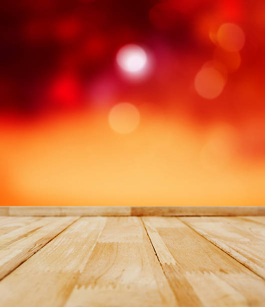 istock An empty Wooden top table with defocused festive lights background 623702238