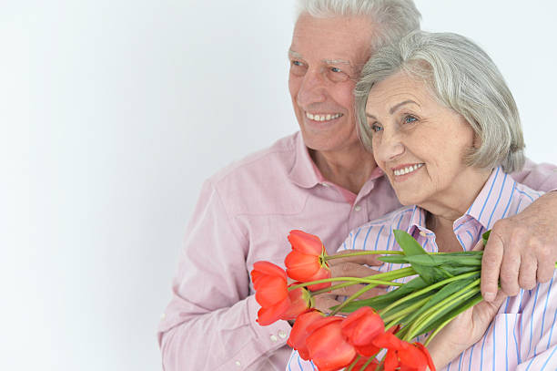 istock Mature couple with poppies 623702400