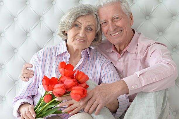 istock Mature couple with poppies 623703478