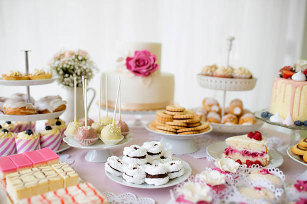 istock Table with loads of cakes, cupcakes, cookies and cakepops. 623708472