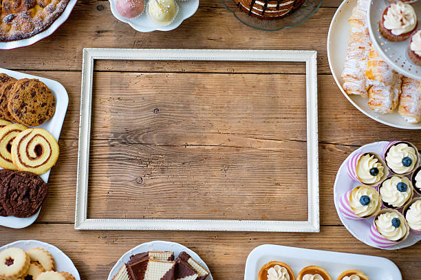 istock Picture frame and cake, cookies, cakepops, cupcakes. Copy space. 623710276