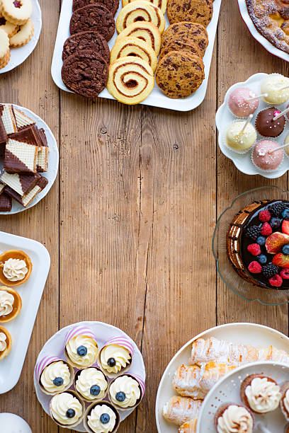 istock Cake, cookies, cakepops, waffers, cupcakes and tarts. Copy space 623710418