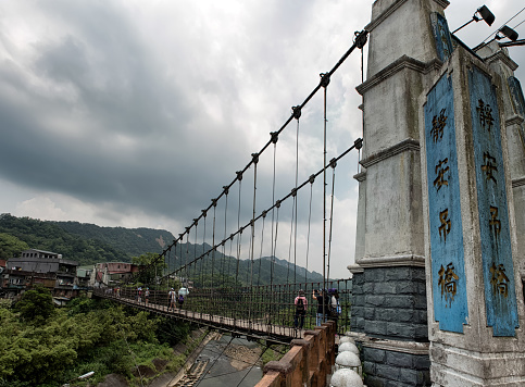 Shifen, Taiwan - JUL 24, 2016: Jingan Suspension Bridge linked between Shifen and Nanshan Village at Shifen, Taiwan.