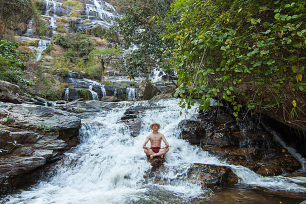 istock The man standing at Mae Ya Waterwall 623713852