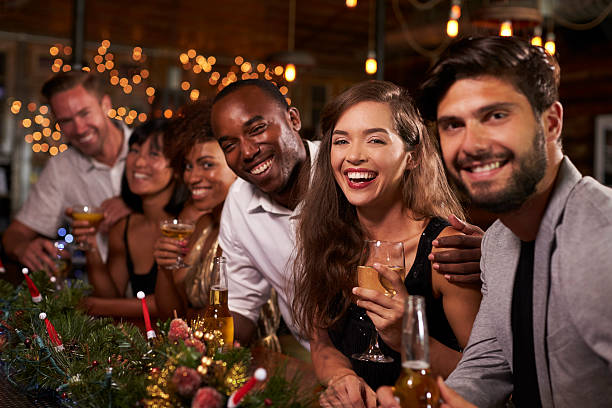 istock Friends enjoying Christmas celebrations look to camera 623714134