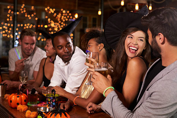 istock Friends having fun at a Halloween party in a bar 623714254