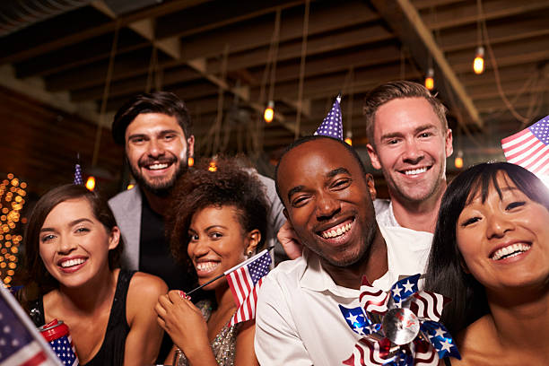 istock Friends with US flags at a 4th July party in a bar 623714390