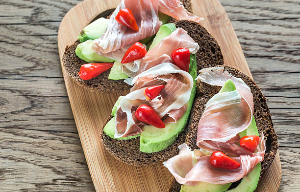 istock Sandwiches with avocado and prosciutto 623714402