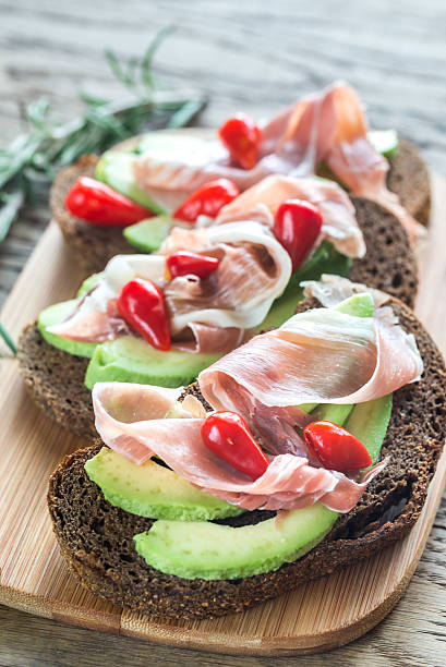 istock Sandwiches with avocado and prosciutto 623714752