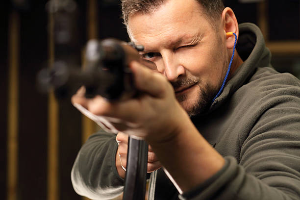 istock Sport shooting range. The man at the shooting range 623715358