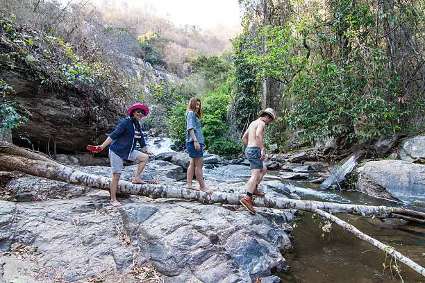 The family at Mae Ya Waterwall, Inthanon National Park, Chiangmai, Thailand