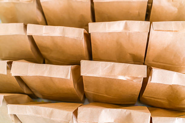 istock Rows of brown paper bags 623716928