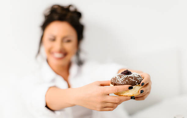 Eating donut in bed