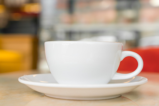 Coffee cup on a table in a café