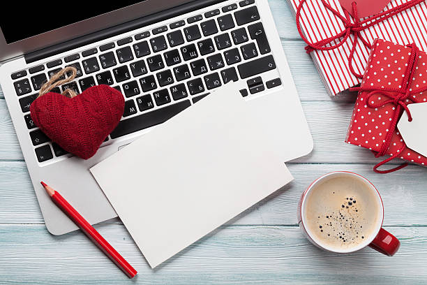 istock Working on laptop and wrapping gifts 623741674
