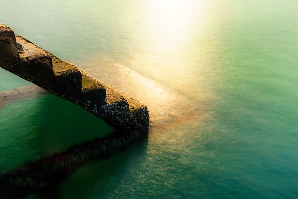 istock long explosure of pier step down in to the sea 623743134
