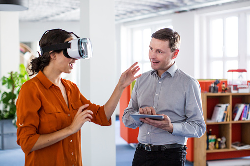 Two colleagues at an office working on virtual reality software