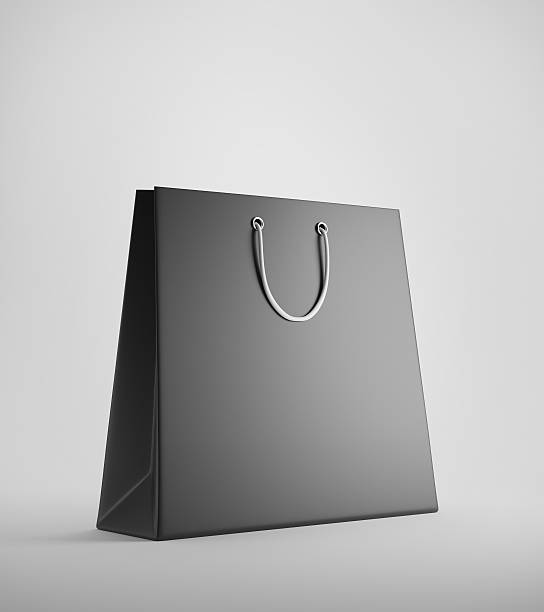 istock Black shopping bag against white background 623744754