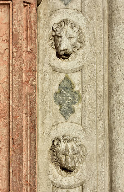 istock Two Saint Mark Lion heads on gothic portal 623745602