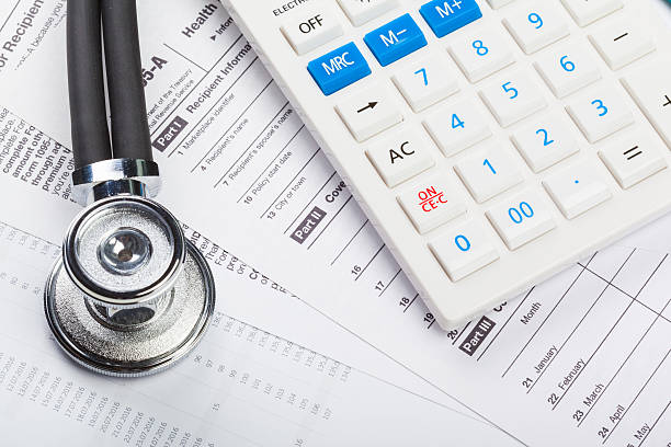 istock Health care costs. Stethoscope and calculator 623746126
