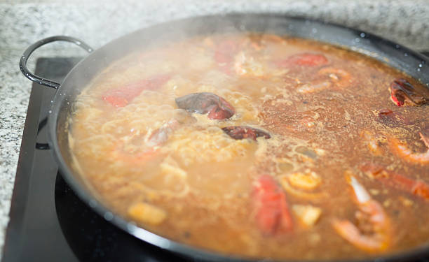 istock Paella cooking on an electric stove. 623746918