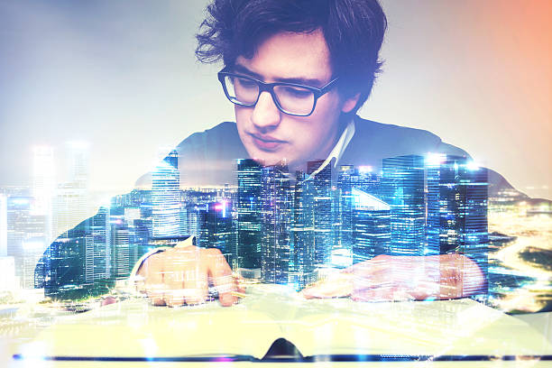 istock Man reading big book in city 623747970