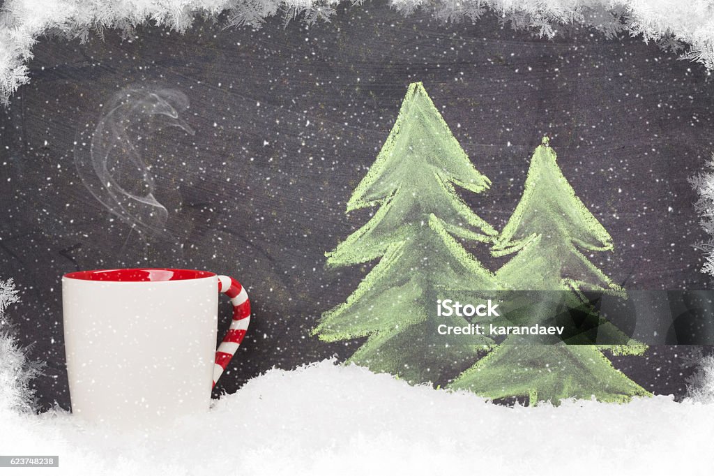 Christmas hot drink and hand drawn xmas fir tree Christmas hot drink and hand drawn xmas fir tree with snow Alcohol - Drink Stock Photo