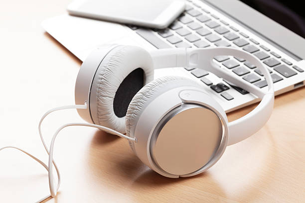 istock Headphones over laptop 623749074