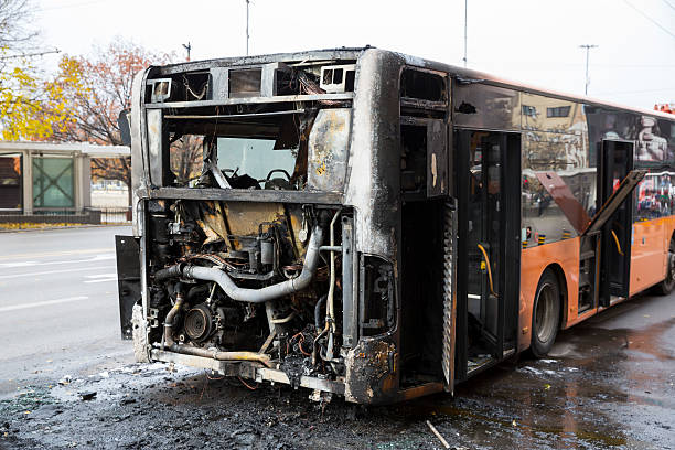 Burnt public traffic bus Burnt public traffic bus is seen on the street after caught in fire during travel and extinguished by firefighters. burned corpse stock pictures, royalty-free photos & images