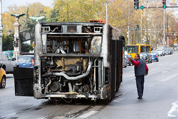 Burnt public traffic bus Sofia, Bulgaria - November 8, 2016: Burnt public traffic bus is seen on the street after caught in fire during travel and extinguished by firefighters. burned corpse stock pictures, royalty-free photos & images