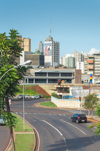 Campo Grande, Ms, Brazil - November 10, 2016: Landscape of the city of Campo Grande. City with some buildings between trees, car traffic and urban art.