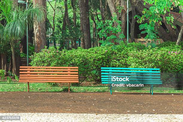 Two Benches Side By Side On A Square Stock Photo - Download Image Now - Town Square, Bench, No People