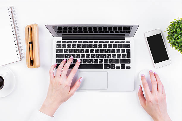 istock Girl typing on keypad topview 623753658