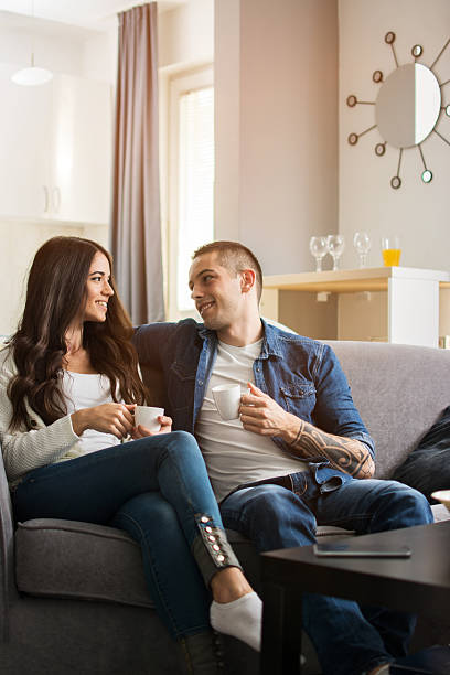 istock Happy young couple drinking morning coffee at home. 623754952