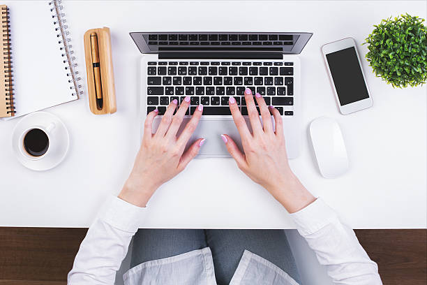 istock Businesswoman typing on keypad topview 623757602